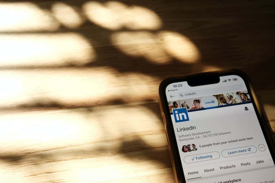 A linkedin app is displayed on a phone.