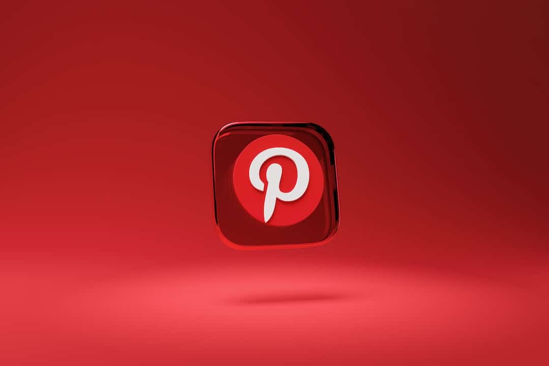 An image of a pintrest logo on a red background.